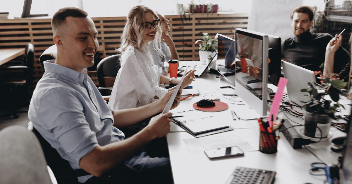 Group of young professionals collaborating in an open office environment